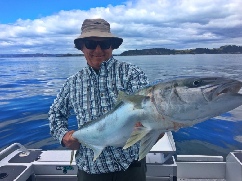 Luxury Adventures client with kingfish aboard private fishing charter