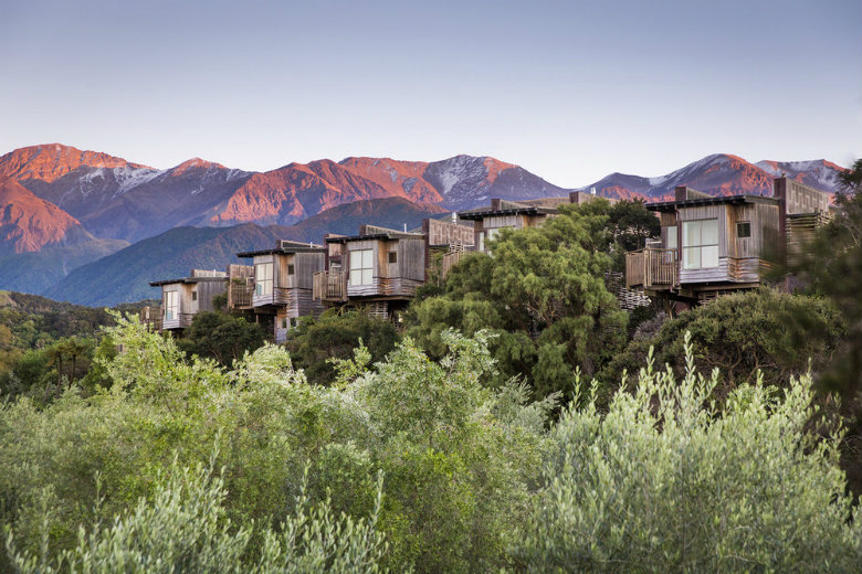 Tree Houses at Hapuku Lodge, with the Kaikoura mountains in the background.